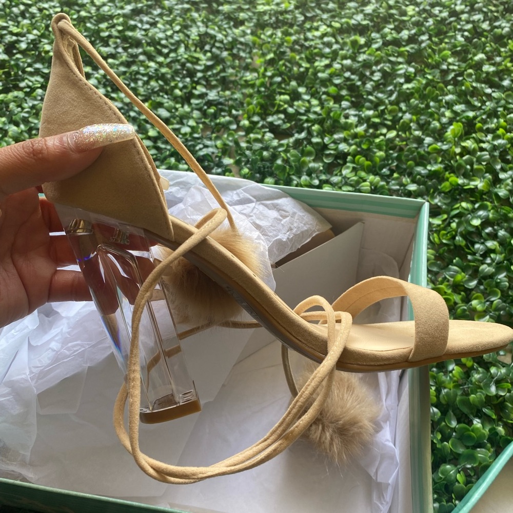 Nude suede sexy heels with clear bottom and tie up with Pom poms